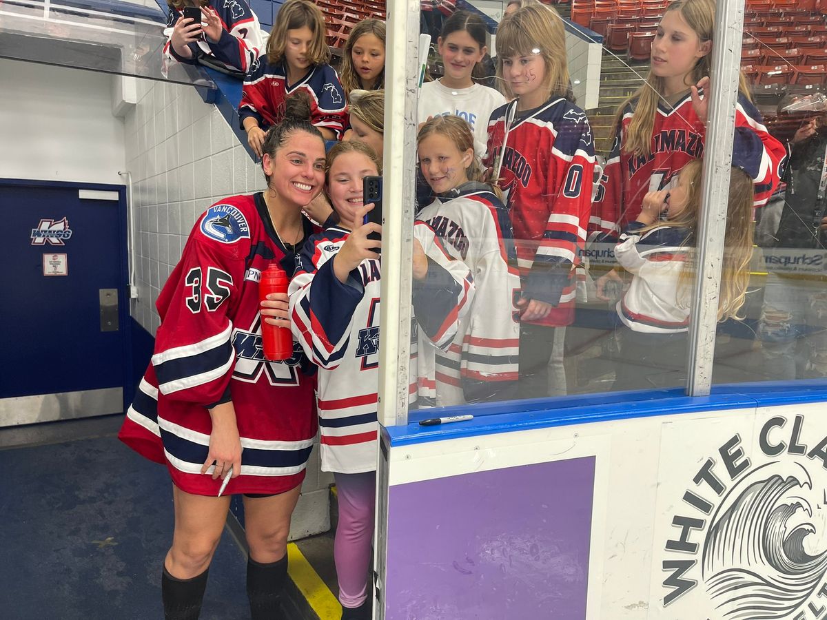 Kalamazoo Wings goalie Mariah Fujimagari poses for a selfie with fans following Saturday night's game against the Toledo Walleye. Fujimagari made 14 saves for the ECHL's first-ever win by a female goaltender. (Photo via Kalamazoo Wings/X, formerly Twitter)