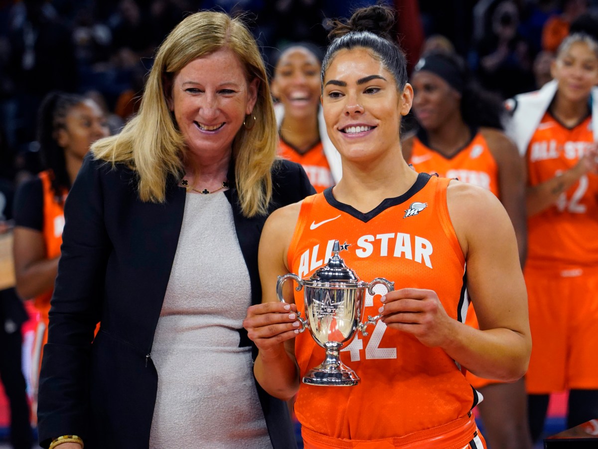 WNBA commissioner Cathy Engelbert presents a small WNBA All Star Game MVP Award trophy, to guard Kelsey Plum